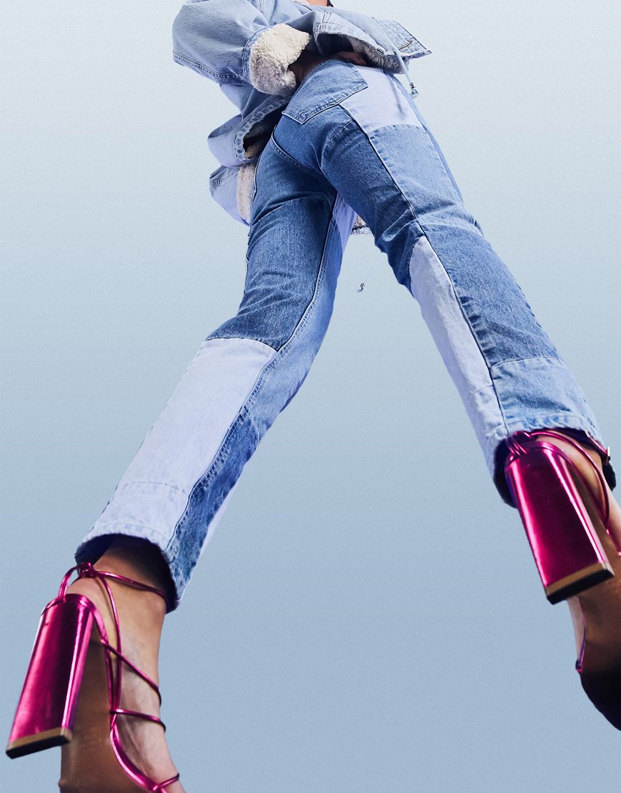 An image of a woman wearing blue patchwork jeans by ASOS Design | ASOS Style Feed