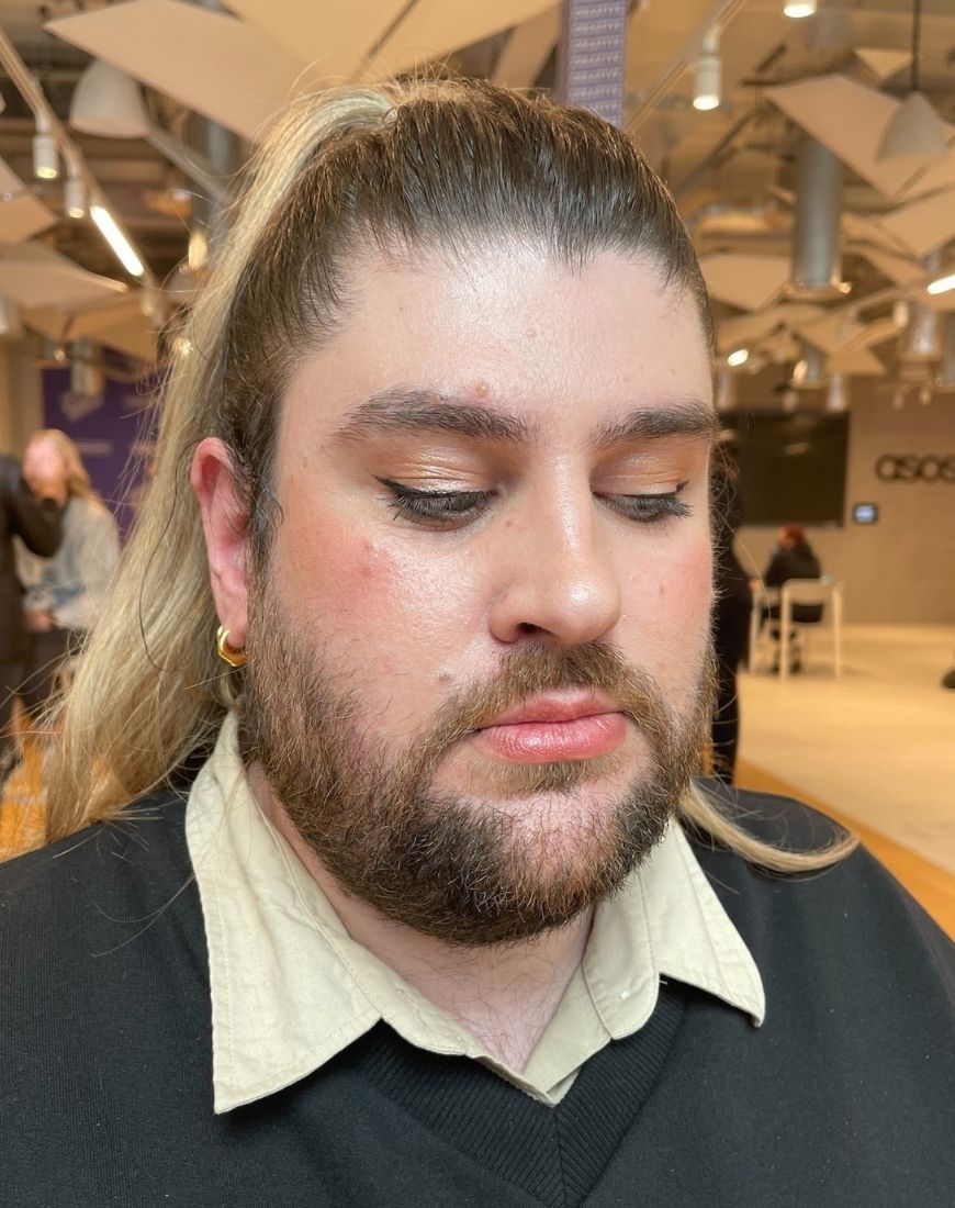 Max has glowing skin, a subtle winged liner and rosy cheeks after his Charlotte Tilbury makeover. | ASOS Style Feed