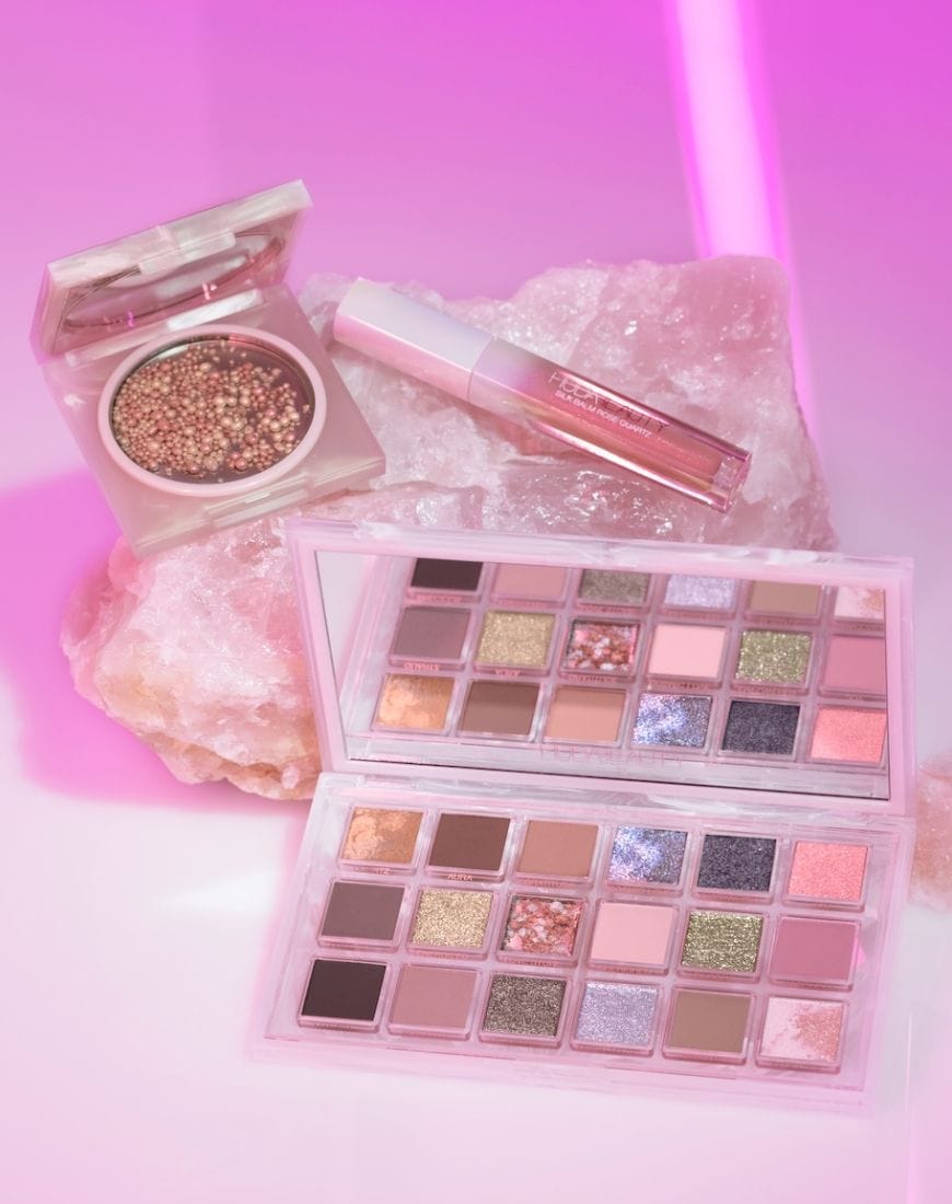 Three items from the Huda Rose Quartz collection including; the Silk Balm Lip Gloss, the Eyeshadow Palette and the Rose Quartz Highlighting Dew. | ASOS Style Feed