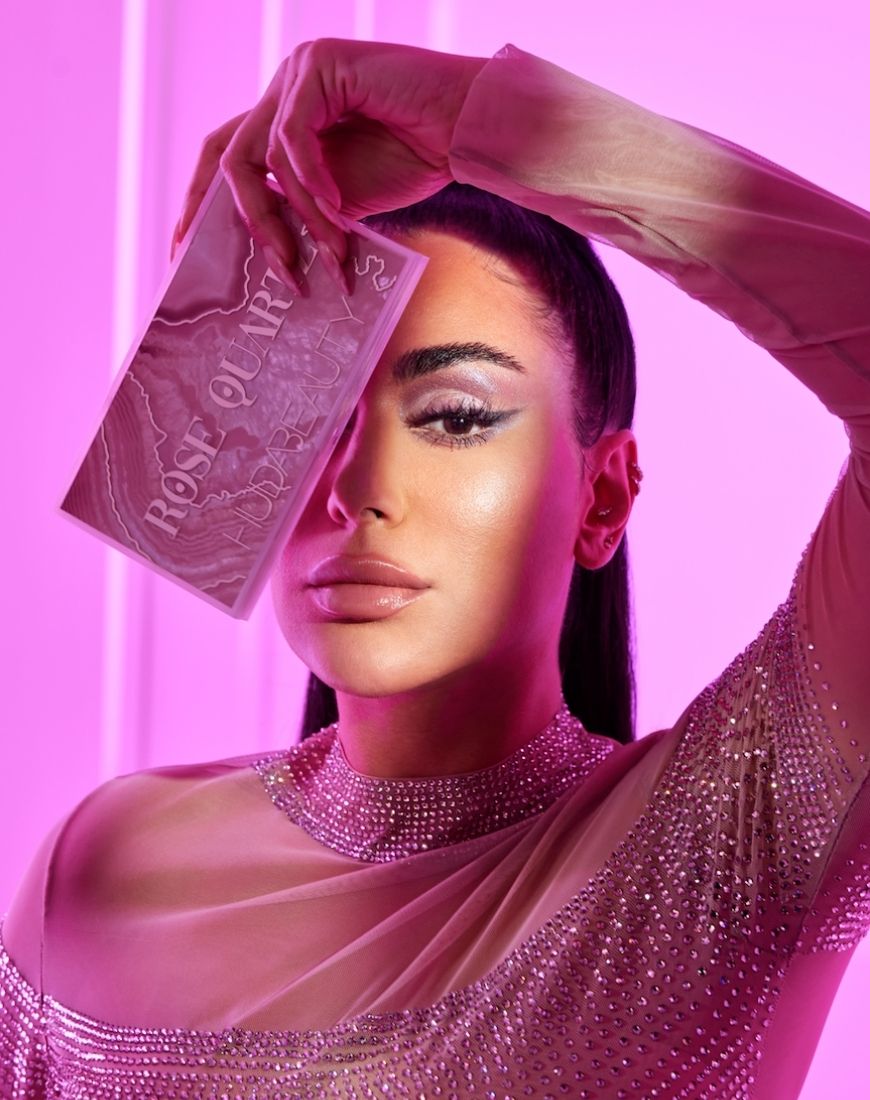 Huda Kattan holds the Rose Quartz collection eyeshadow palette and wears the gorgeous colours on her eyes. | ASOS Style Feed