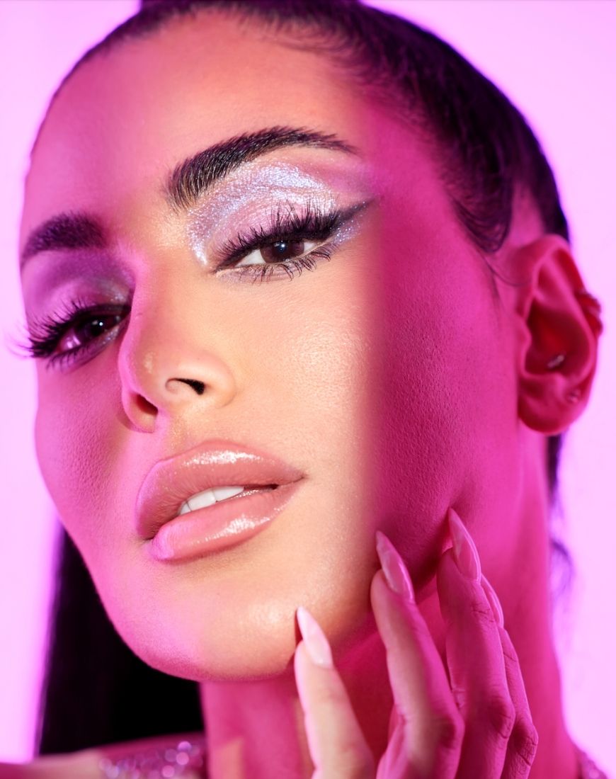 Huda Kattan models her new Rose Quartz collection eyeshadow palette. | ASOS Style Feed
