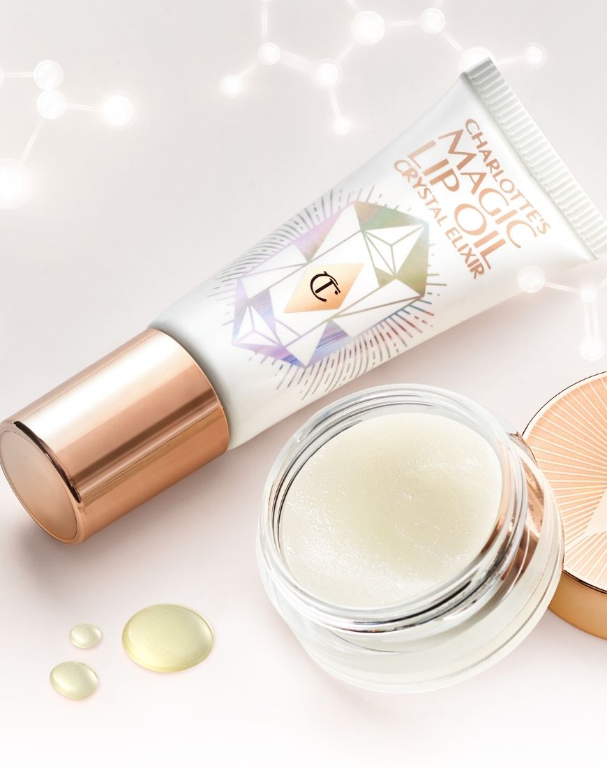 A picture of the Charlotte Tilbury Magic Lip Oil and the Magic Lip Scrub against a white background. | ASOS Style Feed