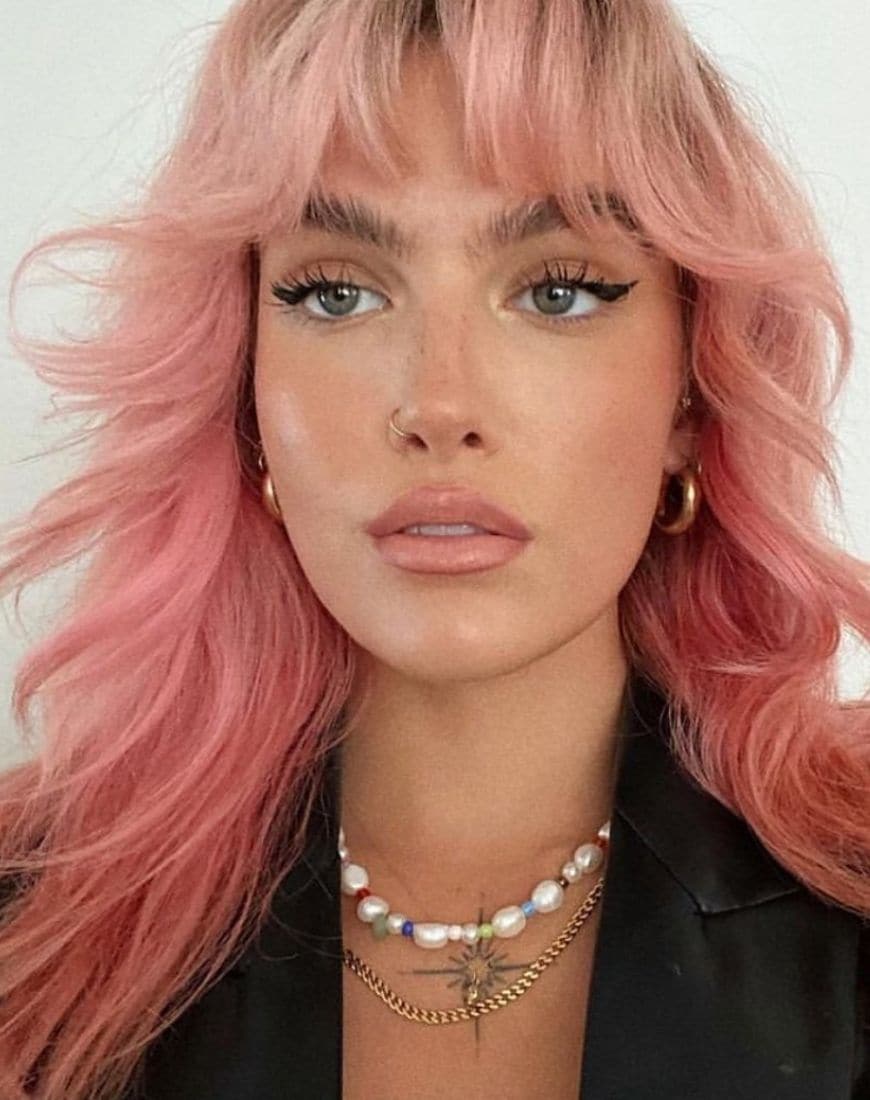 @sophfloyd wears her pink hair in a shaggy 70s style with the front strands framing away from the face. | ASOS Style Feed