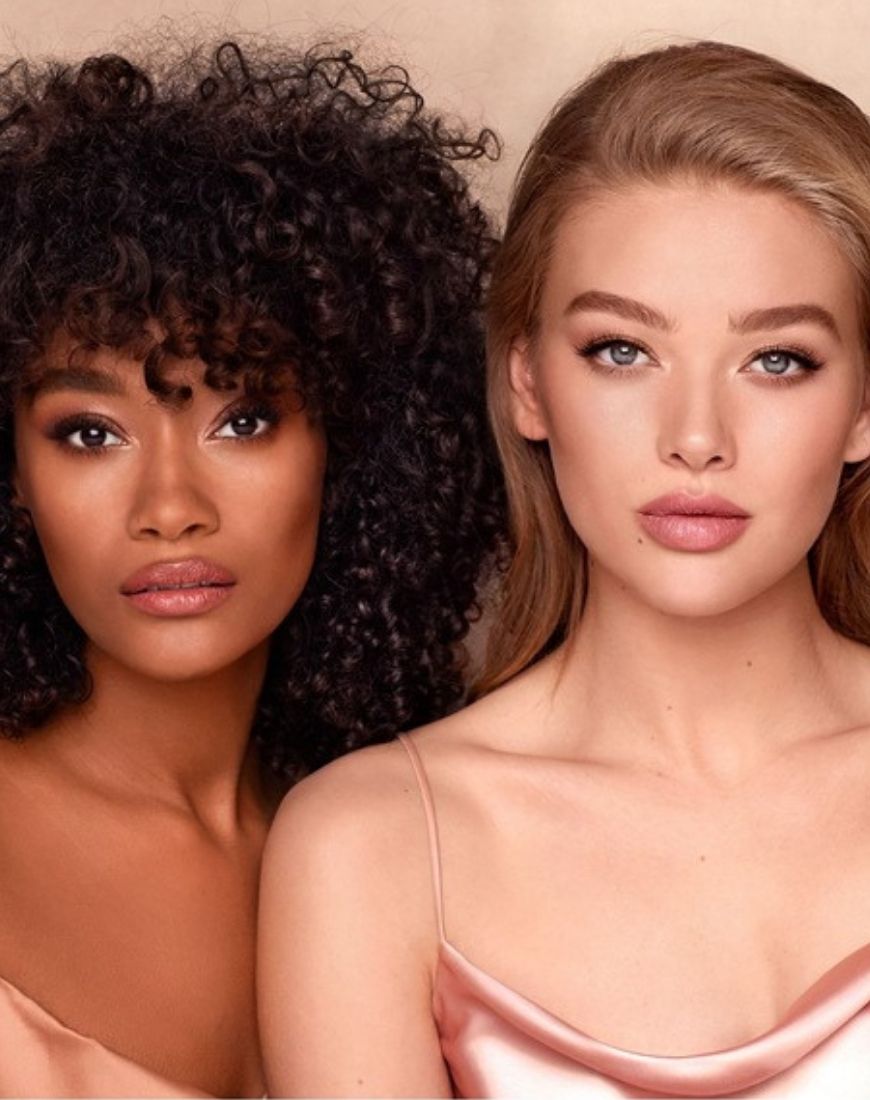 Two models are wearing the Charlotte Tilbury Airbrush Flawless Filter foundation. | ASOS Style Feed