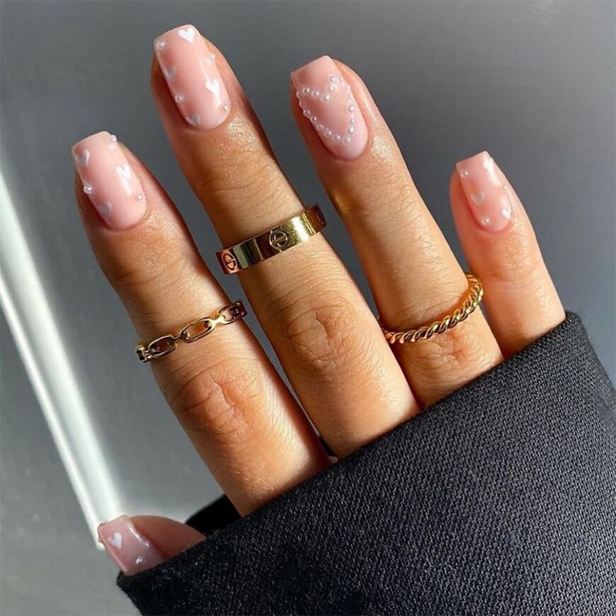 @annagracenails_ has clear nails with tiny pearls stuck on in heart shapes. | ASOS Style Feed