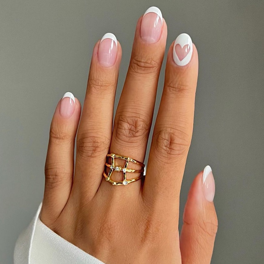 @iramshelton has white French tips but the ring finger is white with a heart shape. | ASOS Style Feed