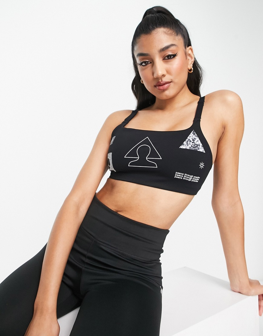 Nike Yoga Indy GRX Dri-FIT light support sports bra in black  | ASOS Style Feed