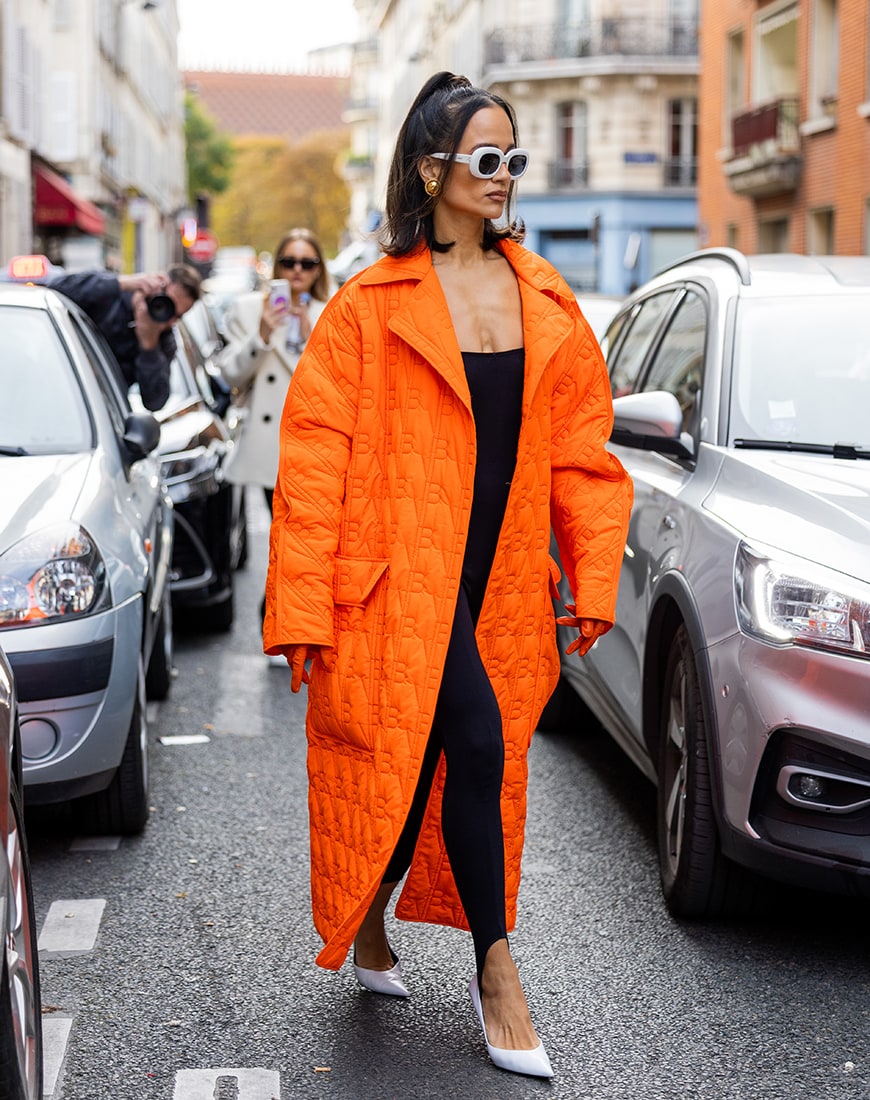 Woman in bright orange coat | ASOS Style Feed