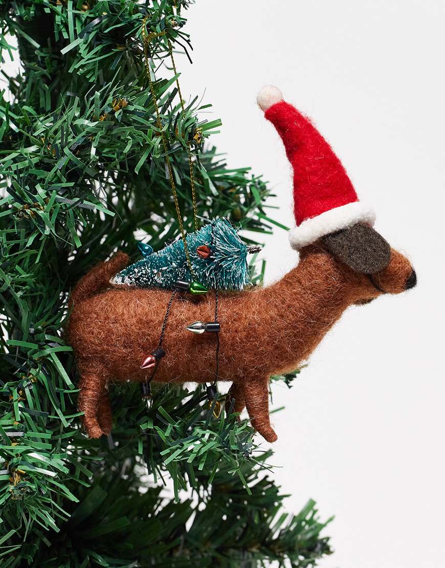 Sausage dog ornament hanging from Christmas tree | ASOS Style Feed