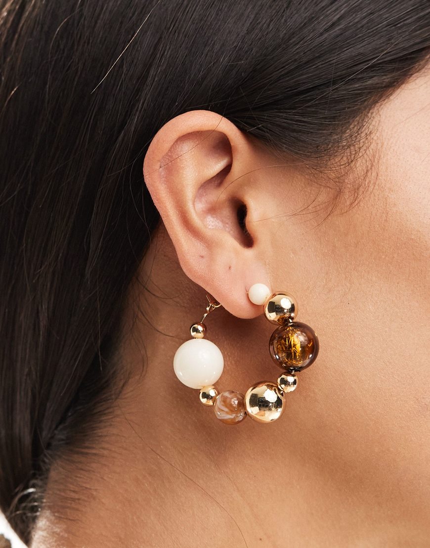 A model wearing a beaded hoop earring | ASOS Style Feed