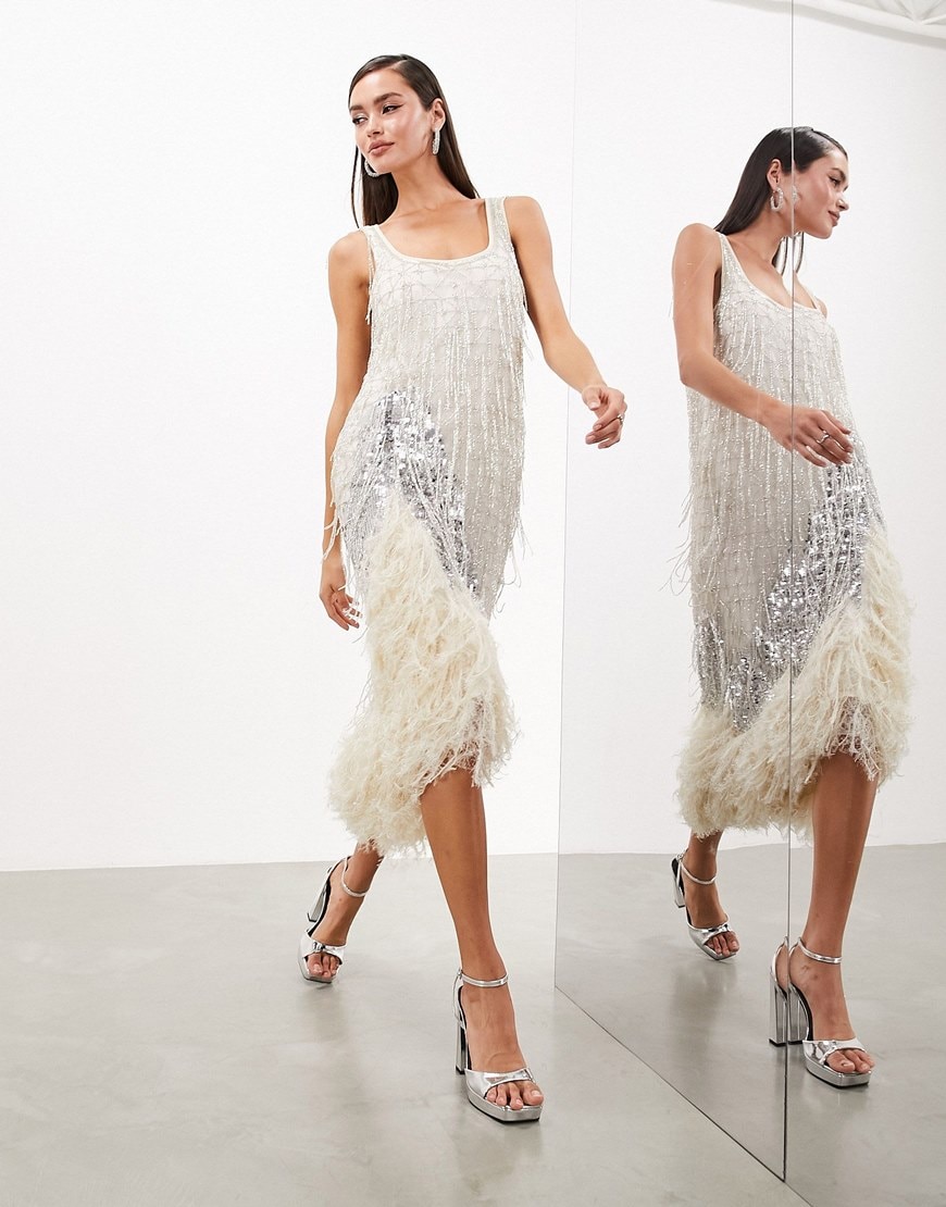 Model wearing embellished tassel midi dress with faux feather hem in silver | ASOS Style Feed