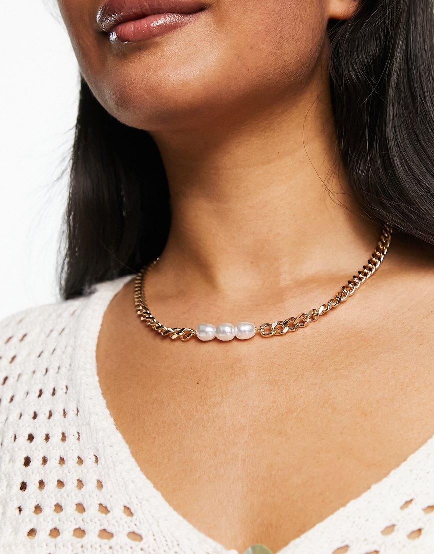 Woman wearing gold chain pearl necklace | ASOS Style Feed