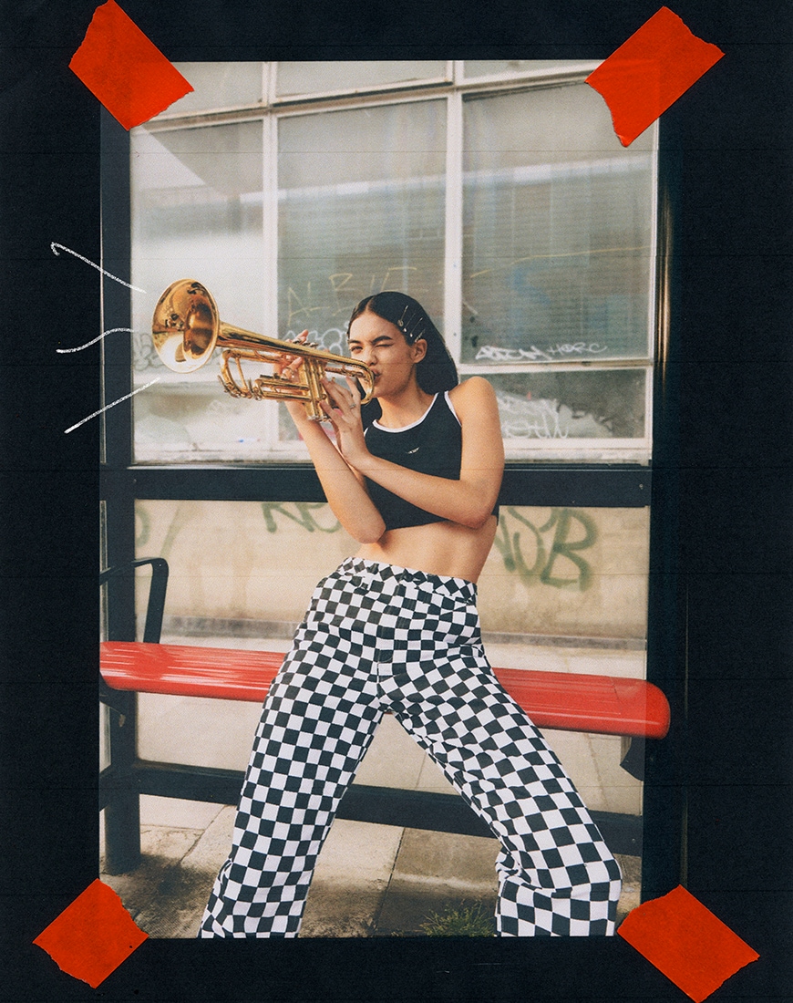 Model in checkerboard trousers at the bus stop | ASOS Style Feed