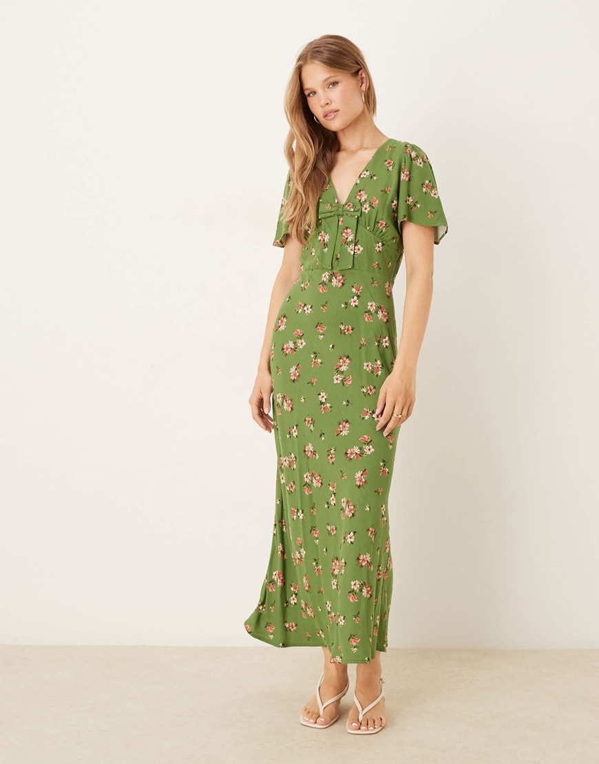 A woman wearing a cream and blue floral dress | ASOS Style Feed