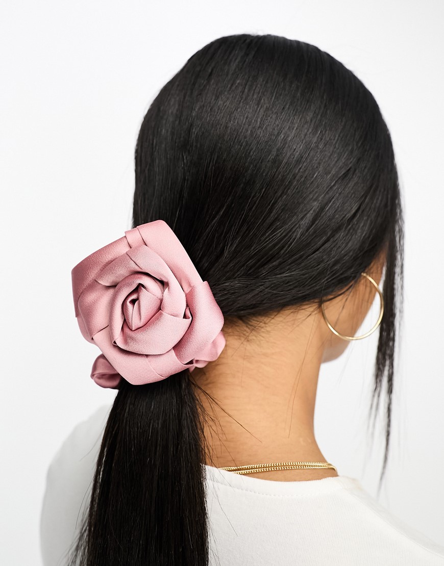 Woman wearing corsage in hair | ASOS Style Feed