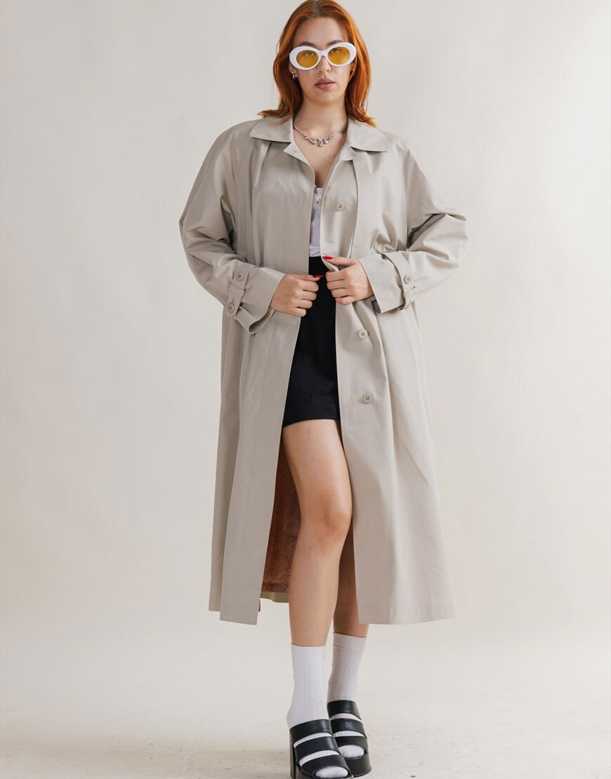 Woman wearing a trench coat | ASOS Style Feed