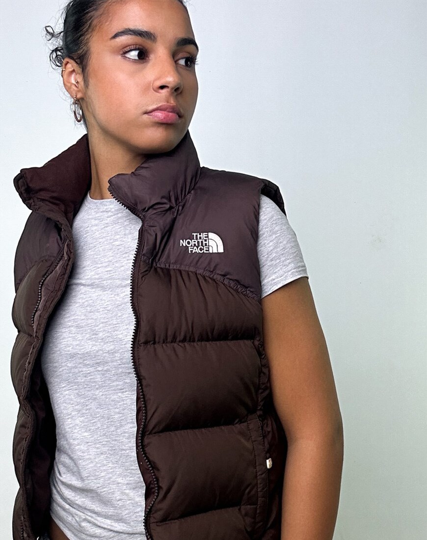 model wearing brown puffer vest