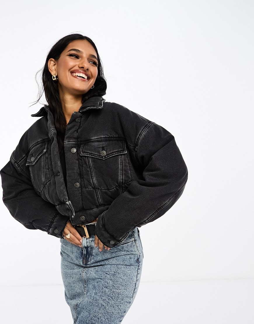 model wearing a grey denim jacket