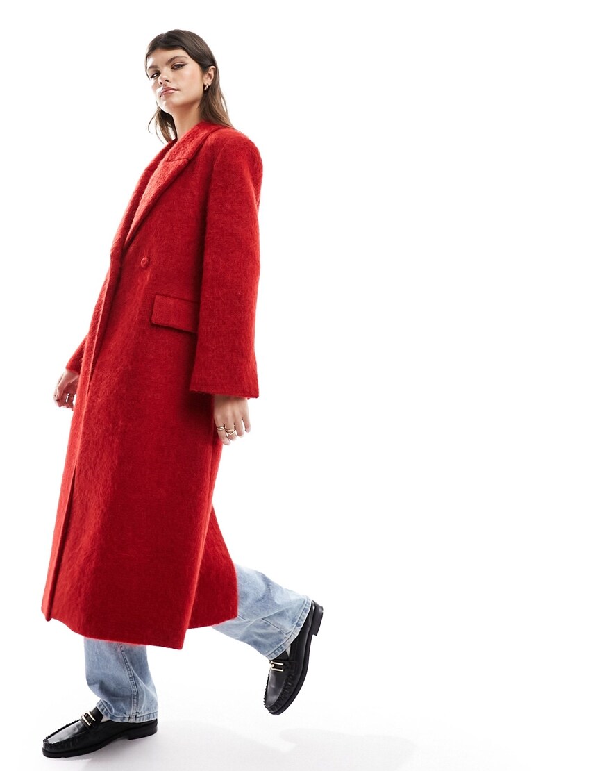 model wearing a red coat