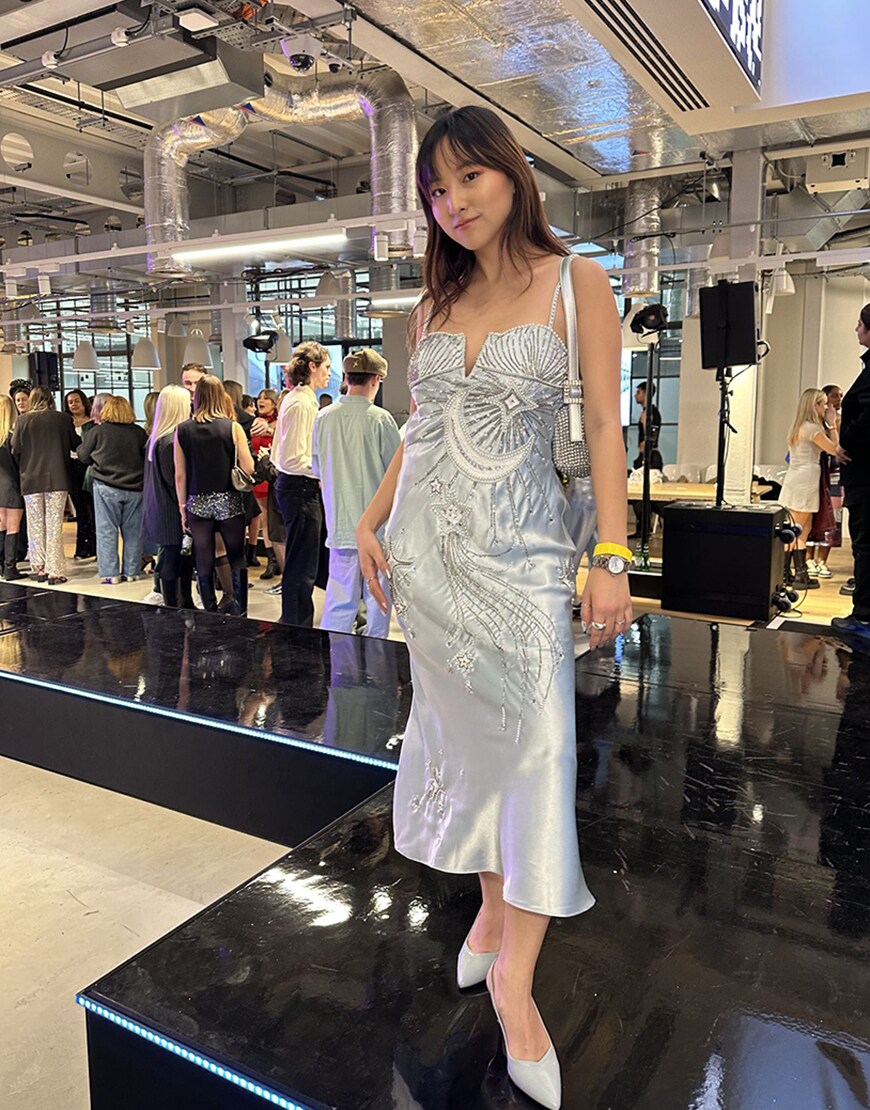 model wearing a silver dress