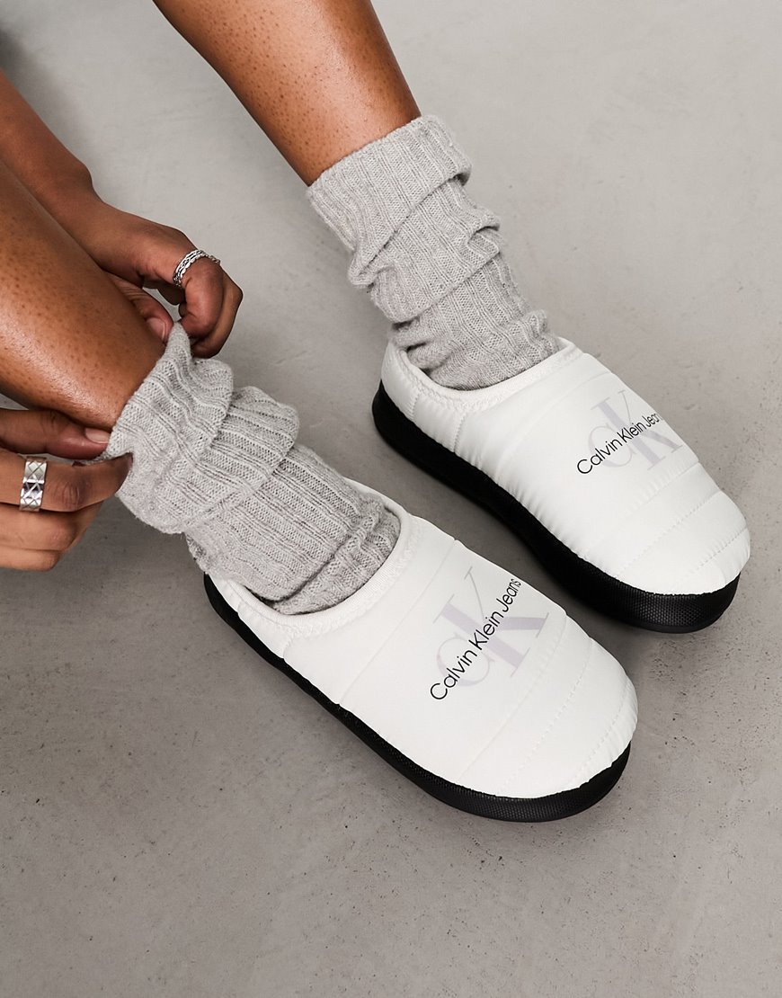 model wearing white slippers