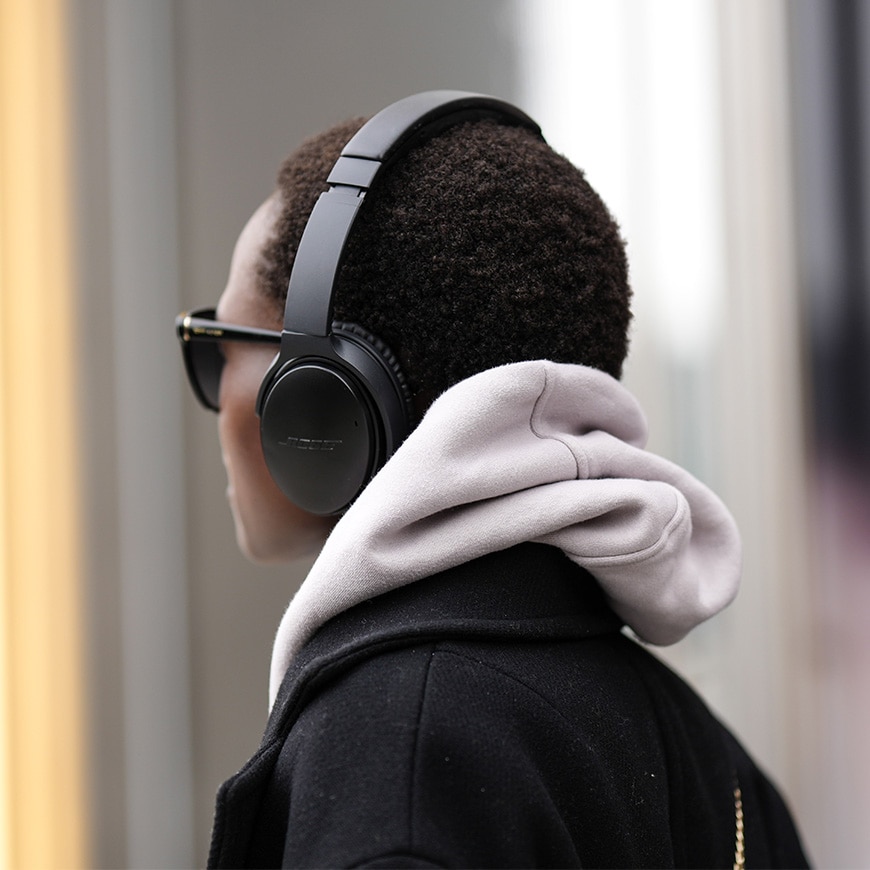Listening to podcast with headphones | ASOS Style Feed