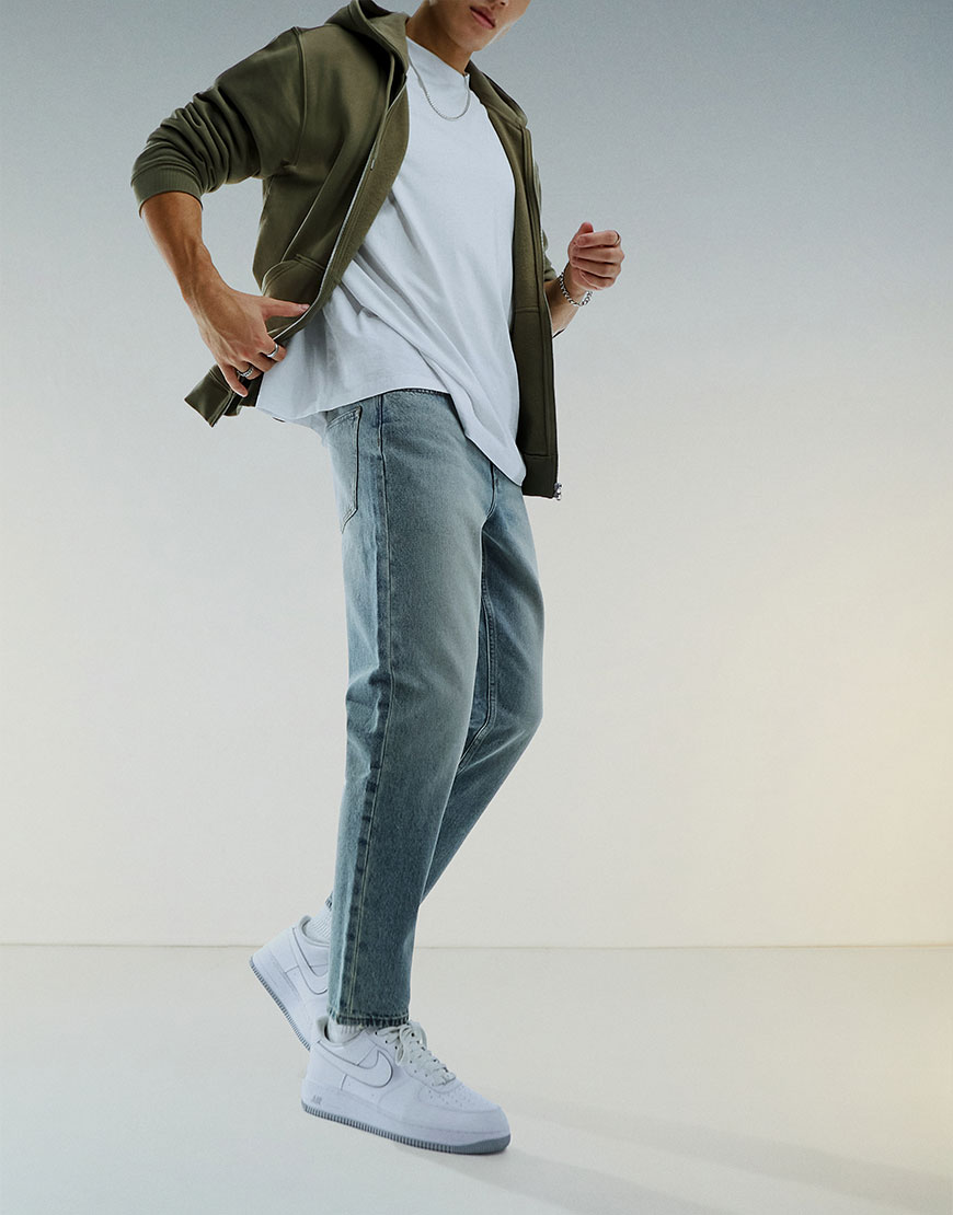model wearing blue jeans
