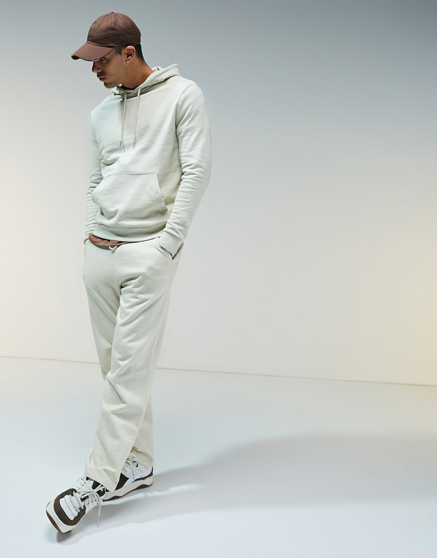 model wearing cream hoody and matching joggers