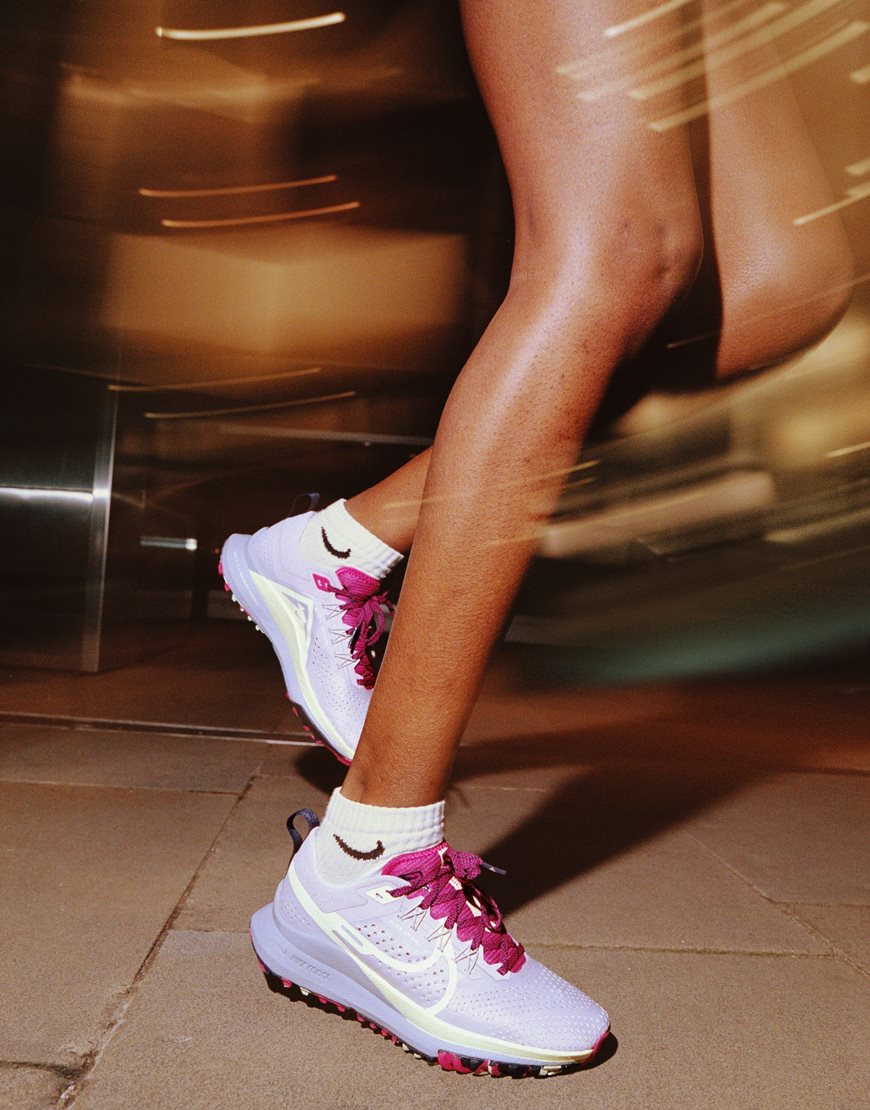 model wearing running trainers