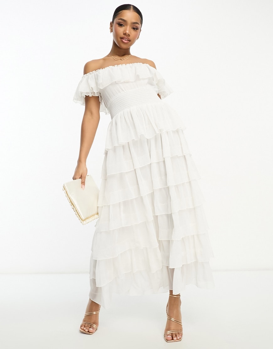 model wearing white tiered dress