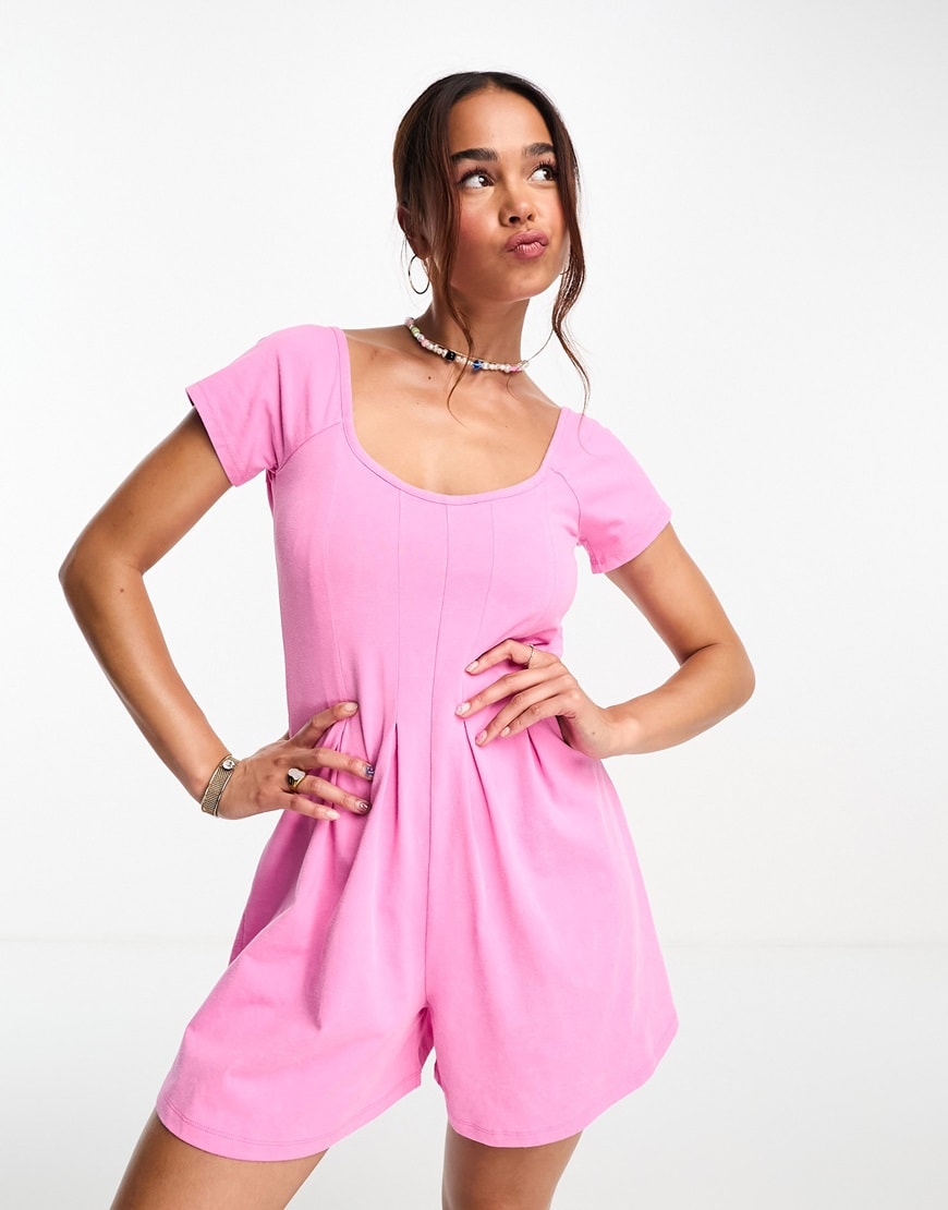 model wearing pink playsuit