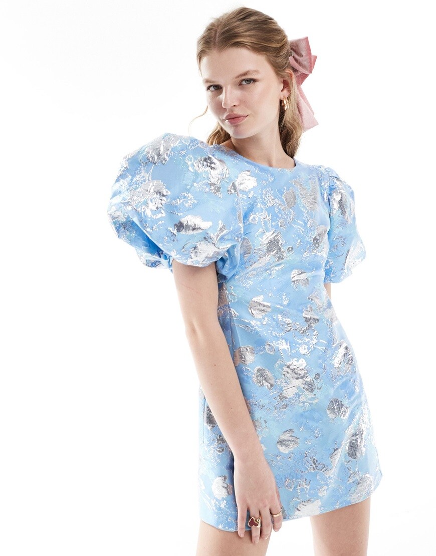 model wearing blue dress