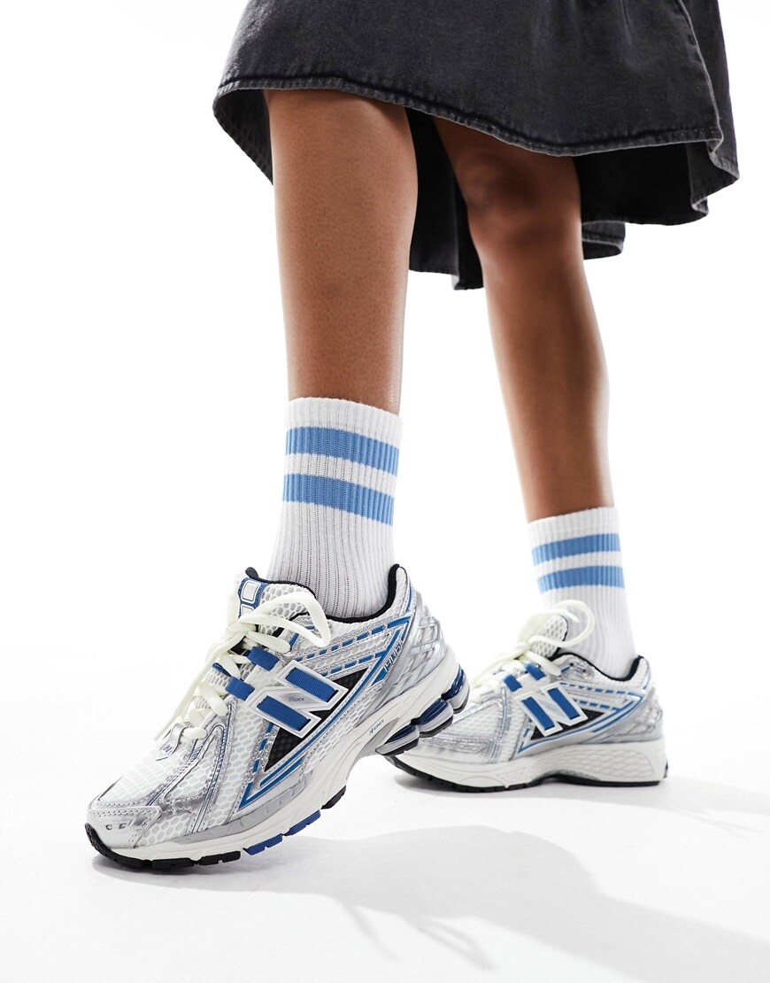Model wearing New Balance trainers in blue, white and silver | ASOS Style Fee