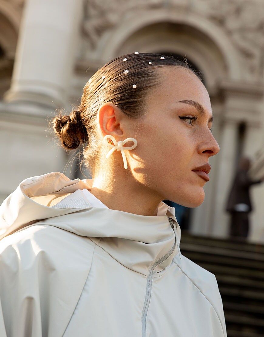 A woman wearing hair clips at London Fashion Week 2024 | ASOS Style Feed