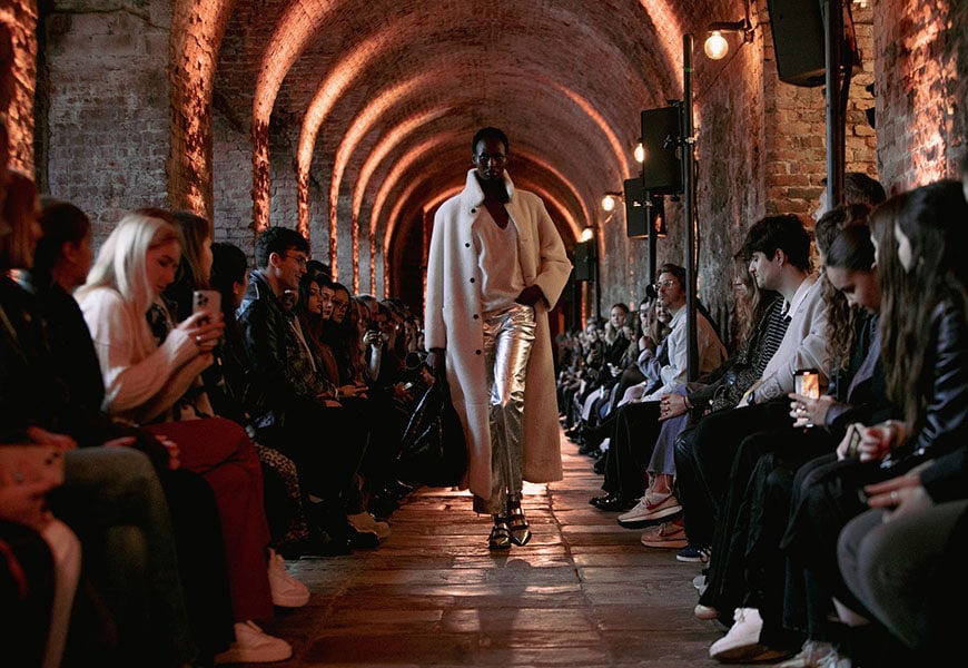 Model wearing silver trousers and white coat | ASOS Style Feed