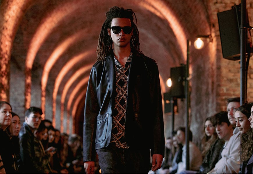 Model wearing sunglasses walking down runway | ASOS Style Feed