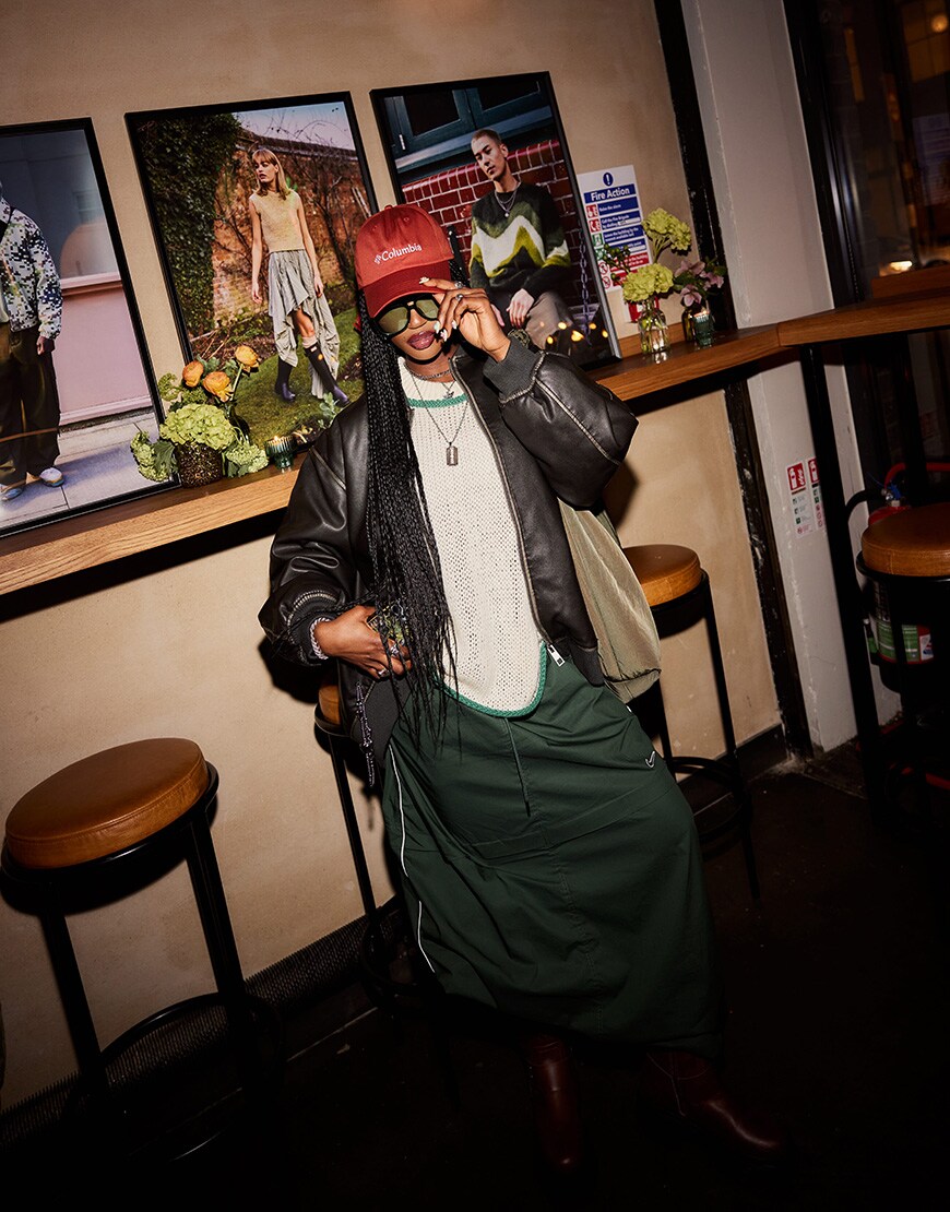 _thisisclaire wearing a Columbia cap, knitted jumper and leather jacket | ASOS Style Feed