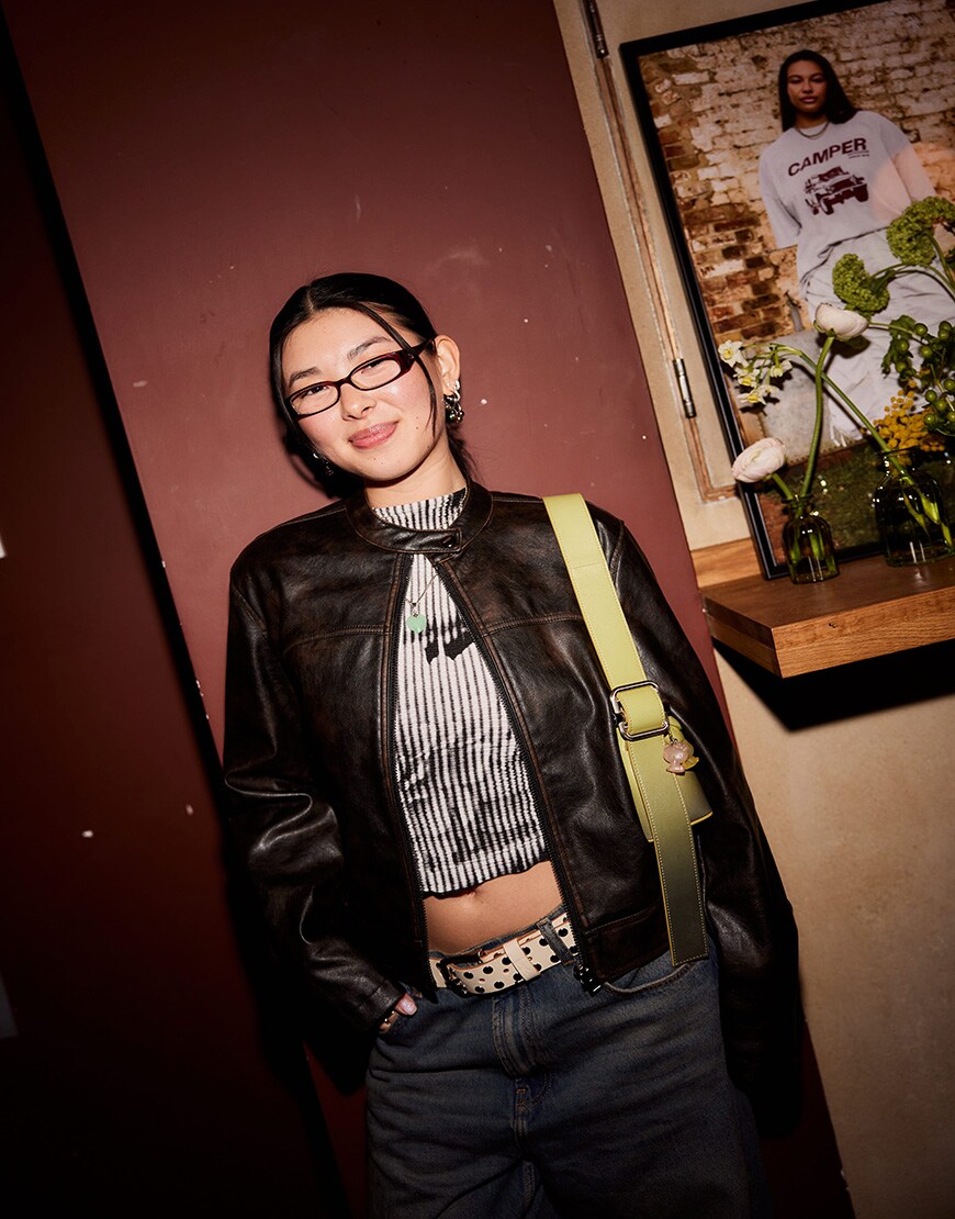 Tzefits wearing a leather jacket and jeans | ASOS Style Feed