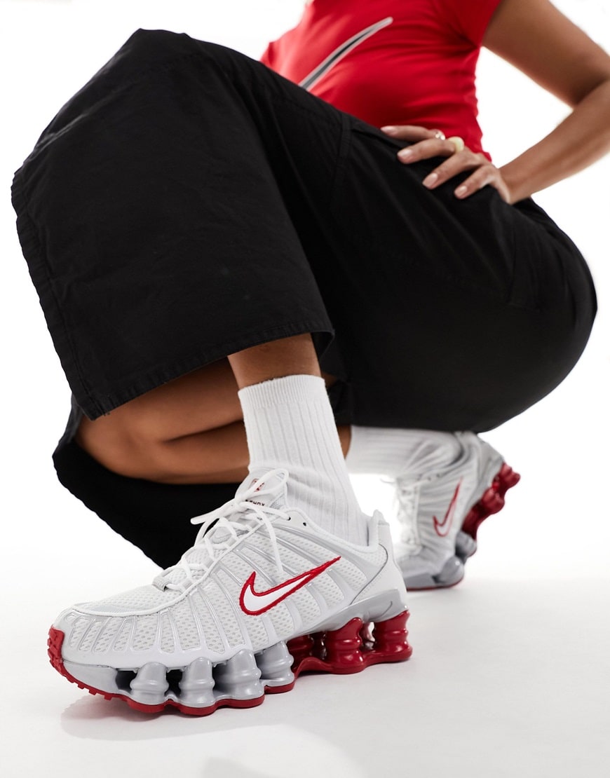 Woman wearing Nike Shox TL unisex trainers in white and red | ASOS Style Feed