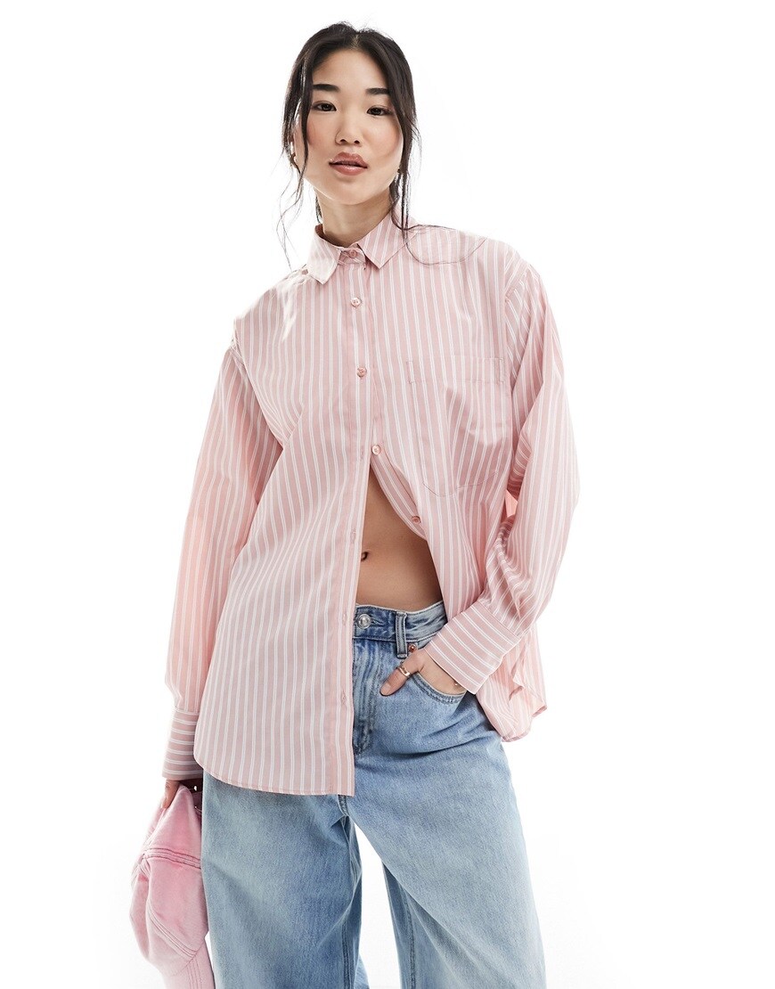 Woman wearing pink and white striped shirt