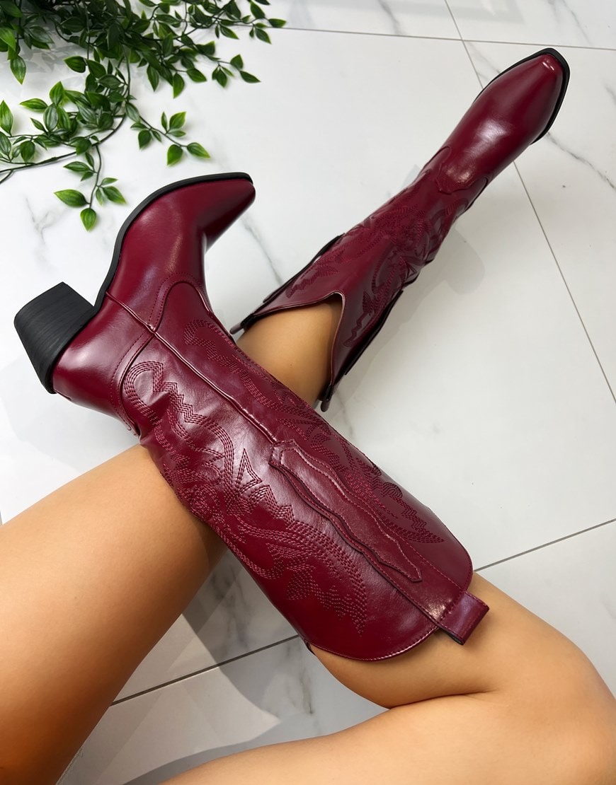 Burgundy cowboy boots with embossed patter