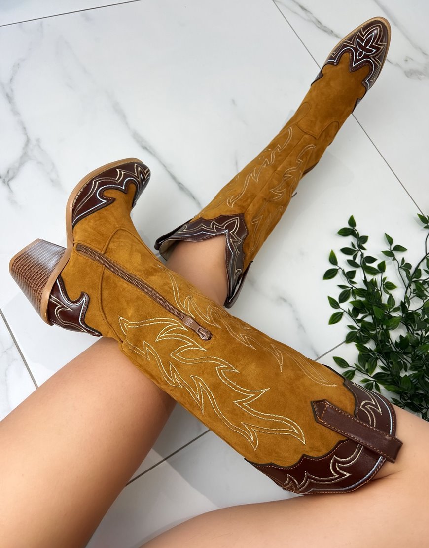 Brown cowboy boots with dark brown detailing
