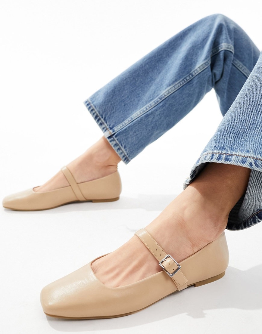 Beige Mary Jane ballet flats worn with blue jeans