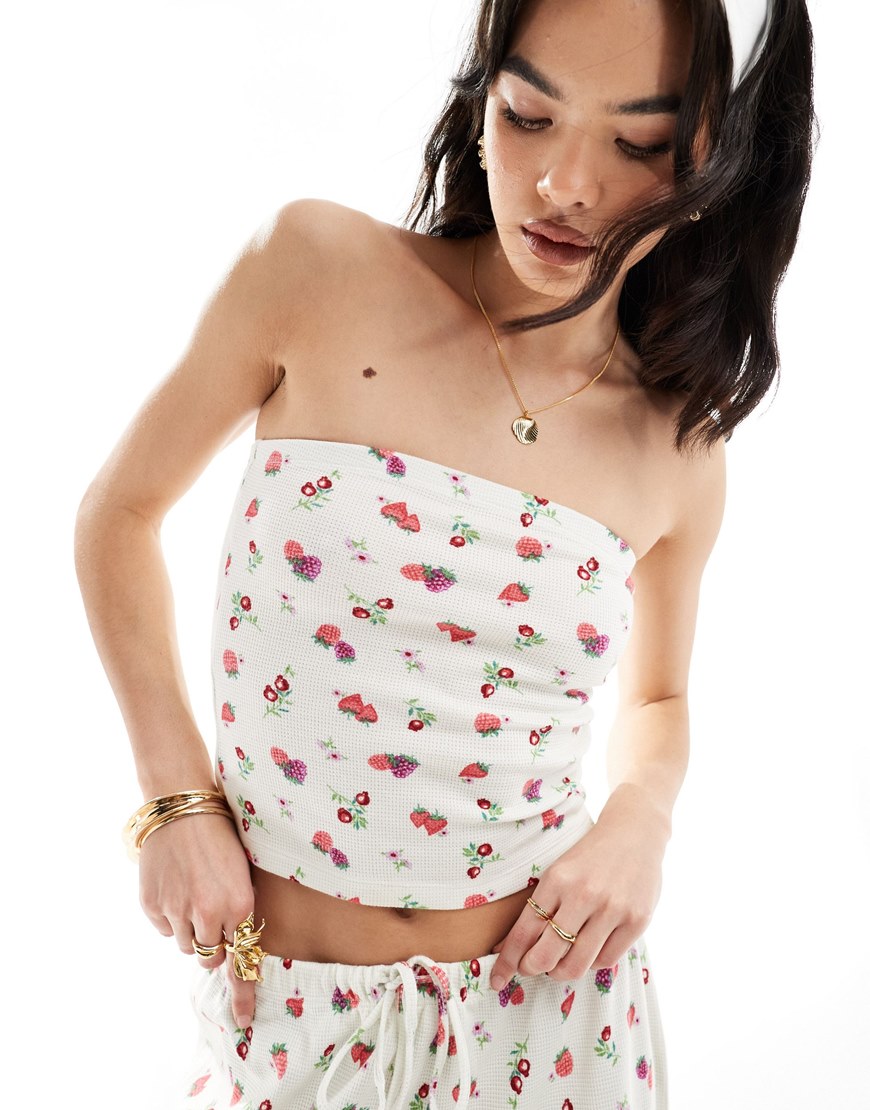 A woman wearing a fruit printed bandeau top | ASOS Style Feed