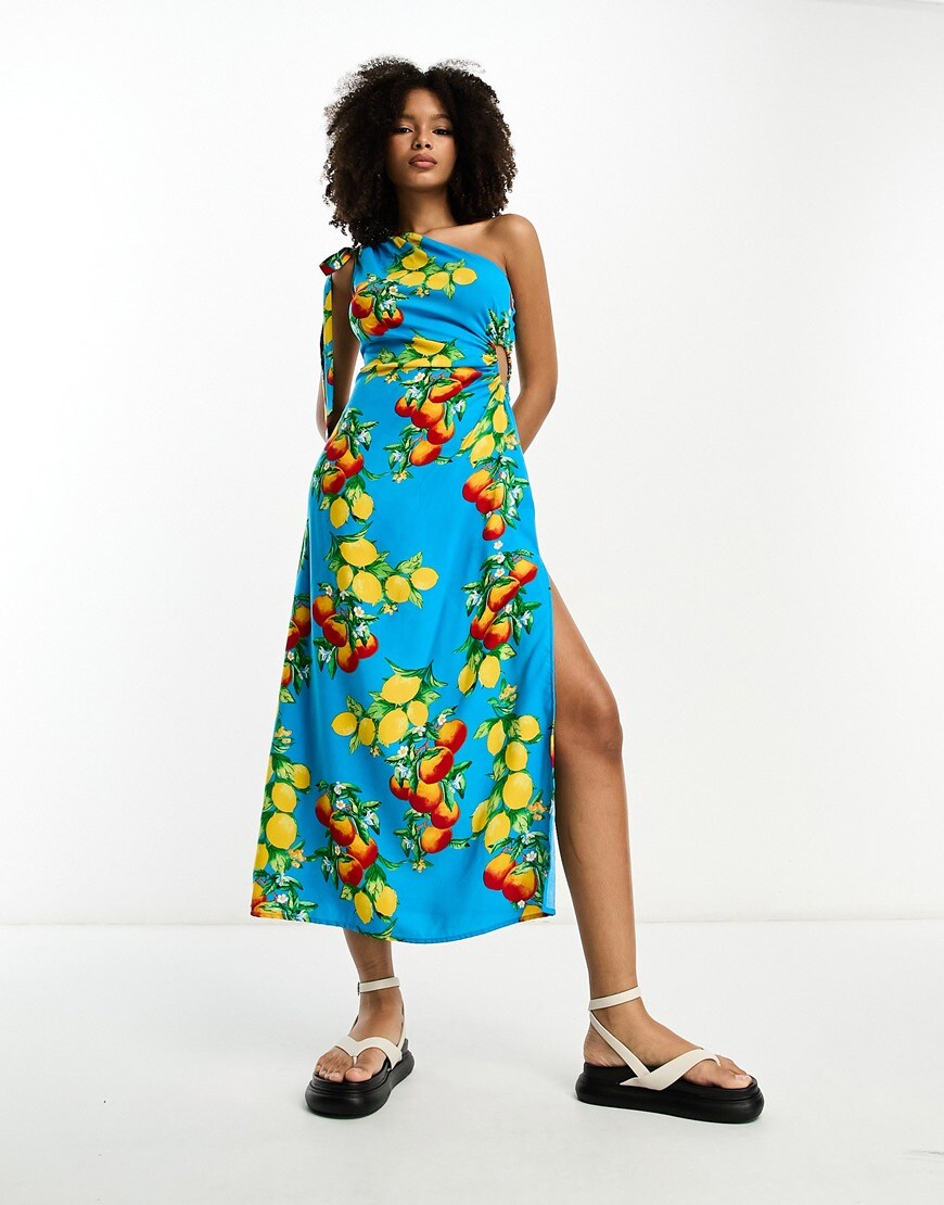 A woman wearing a blue fruit printed dress | ASOS Style Feed