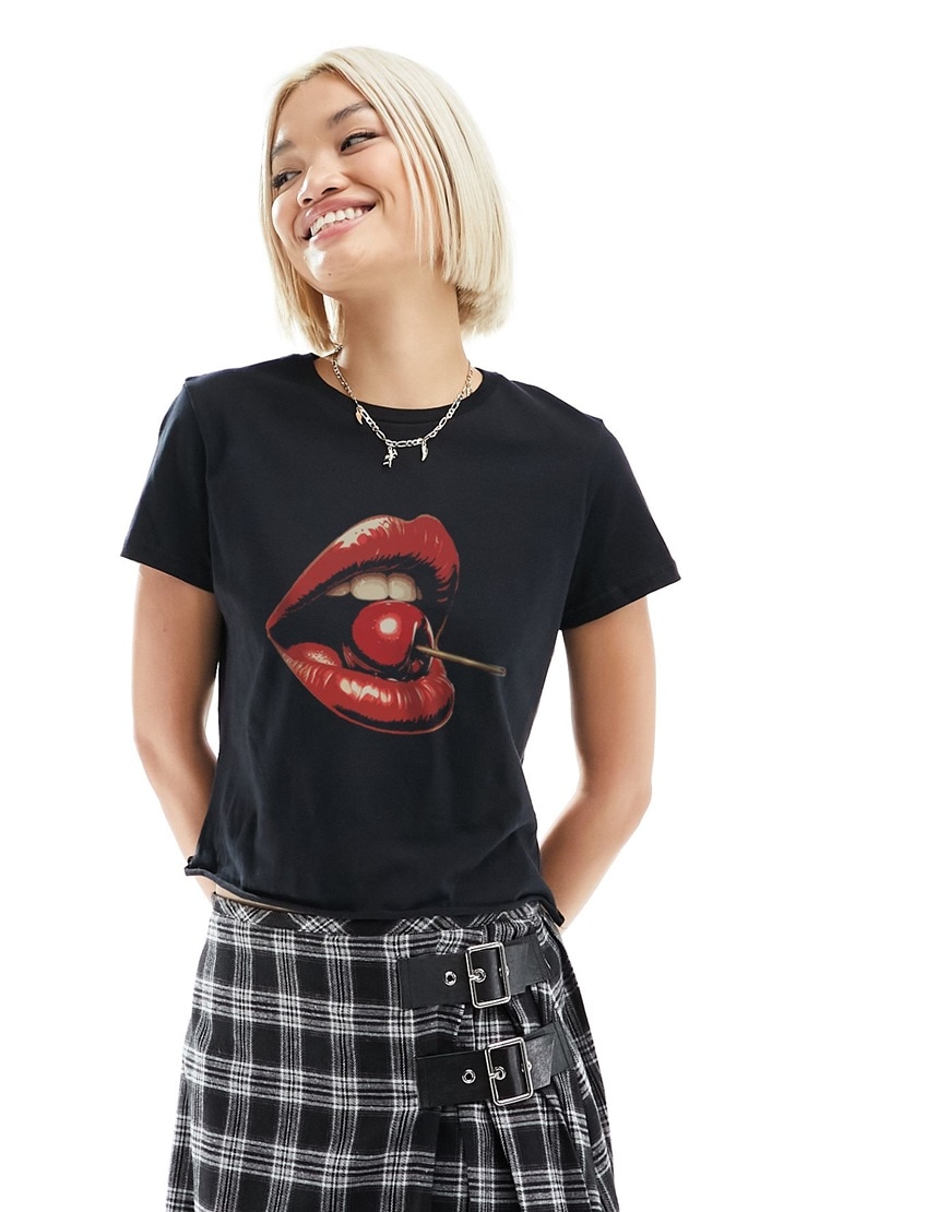 A woman wearing a black lips and cherry print t-shirt | ASOS Style Feed