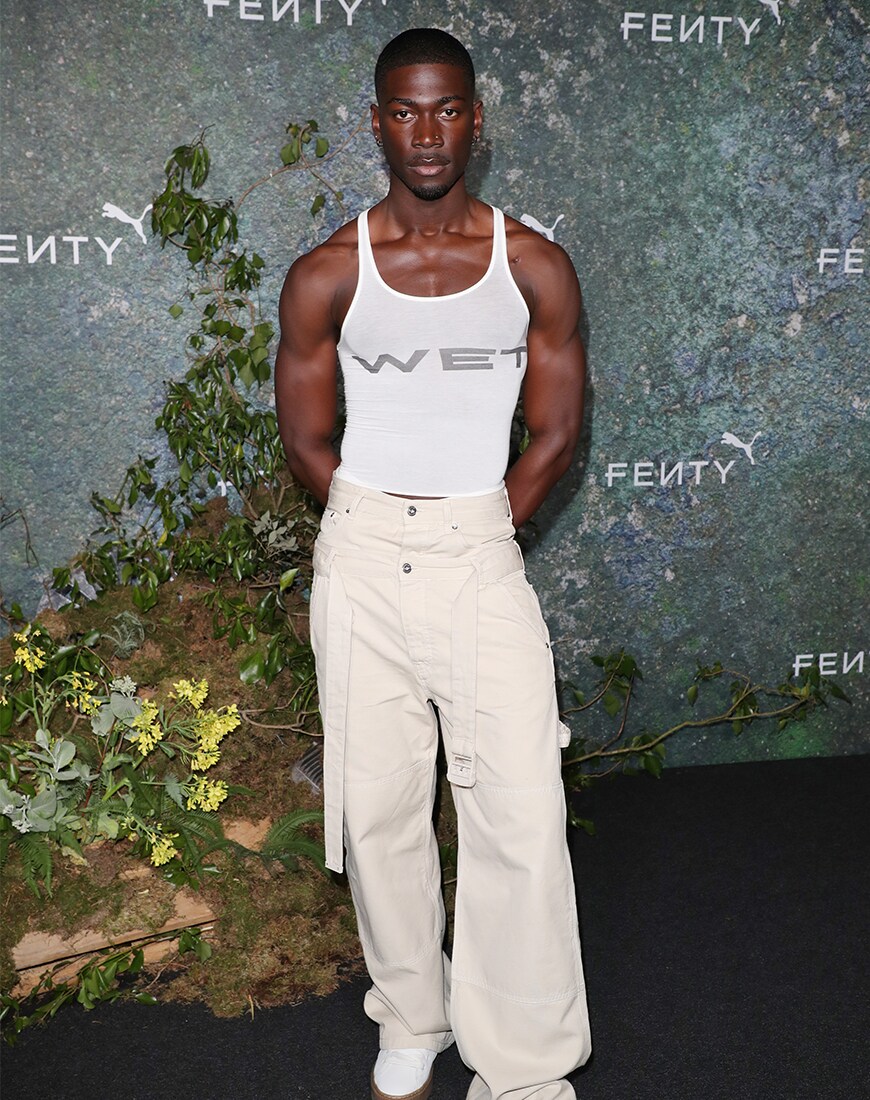 Victor Kunda wearing an all-white outfit