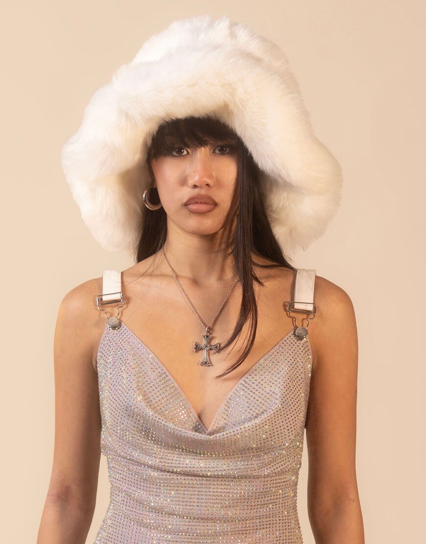 Woman wearing white fluffy hat