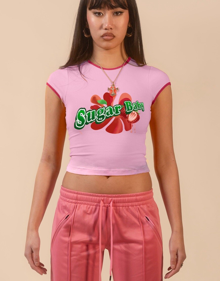 Woman wearing pink ringer t-shirt with slogan