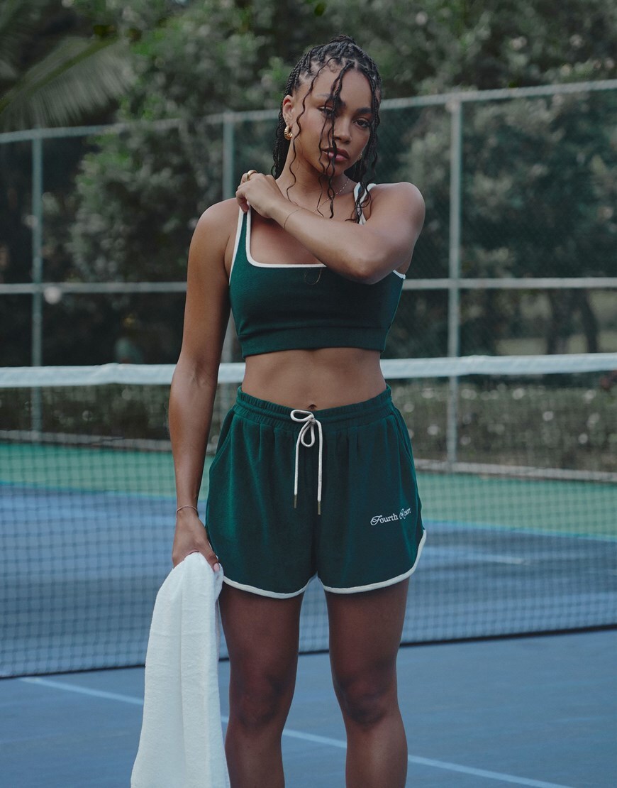 Loz Vassallo wearing a velour emerald green tennis set